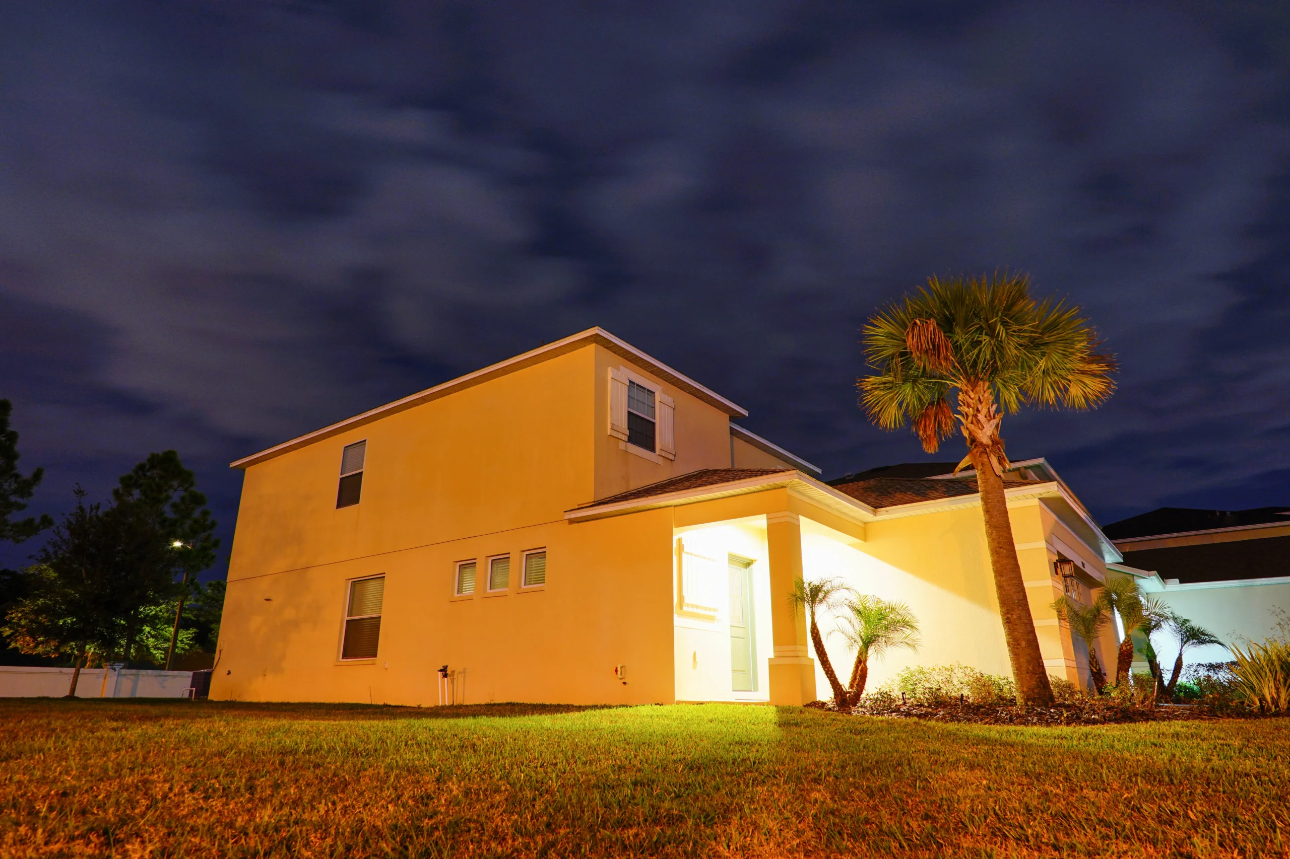 Smart porch light actively deterring intruders at night